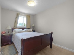 Light-toned wood-finish flooring provides a bright foundation for this room, complemented by neutral wall tones - 
