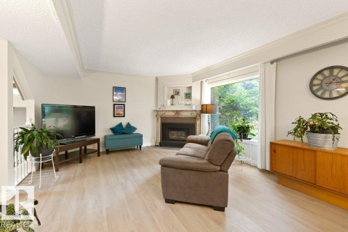 119 Grandin Woods Estates, St. Albert, AB - Indoor Photo Showing Living Room With Fireplace