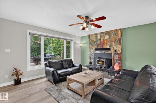 31 River Drive, Devon, AB - Indoor Photo Showing Living Room With Fireplace