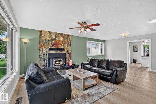 31 River Drive, Devon, AB - Indoor Photo Showing Living Room With Fireplace