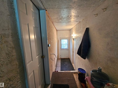 Side entrance leading to house and garage from inside porch - 57415 Range Road 93, Rural St. Paul County, AB - Indoor Photo Showing Other Room