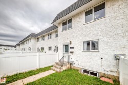 Textured stucco exterior with multiple windows - 