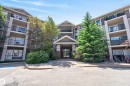 Multi-story building exterior featuring a neutral color palette with dark accents - #6223 7331 South Terwillegar Dr Nw, Edmonton, AB  - Outdoor With Balcony With Facade 