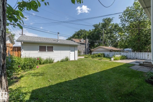 Detached garage with horizontal siding and a window - 5608 122 Avenue, Edmonton, AB 