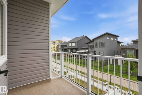 Balcony with white metal railing and composite flooring - 36 150 Everitt Dr, St. Albert, AB - Outdoor With Exterior