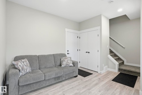 Light wood-finish flooring complements the neutral wall color - 36 150 Everitt Dr, St. Albert, AB - Indoor