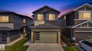 Contemporary two-story residence featuring a two-tone exterior with dark siding and light accents - 423 42 Street, Edmonton, AB 