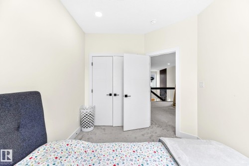 Carpeted room with recessed lighting and neutral wall tones - 423 42 Street, Edmonton, AB 