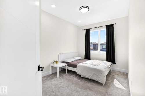 Bright room with light grey carpet flooring and white walls - 423 42 Street, Edmonton, AB 