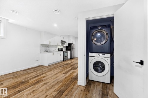Stacked laundry appliances within a dedicated closet - 423 42 Street, Edmonton, AB 