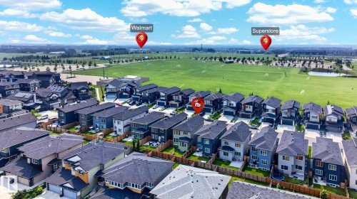 Modern residential neighborhood with a variety of detached homes featuring dark shingle roofs and mixed exterior finishes - 423 42 Street, Edmonton, AB 