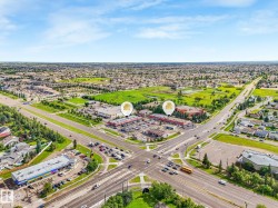Aerial perspective showcasing commercial properties at a central intersection - 