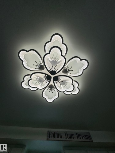 Floral-inspired flush-mount ceiling light fixture with integrated backlighting - 4912 49 Avenue, Onoway, AB 