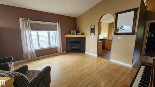 5110 50 Avenue, Elk Point, AB - Indoor Photo Showing Living Room With Fireplace