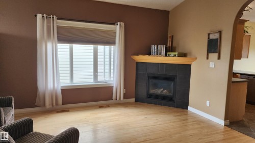 5110 50 Avenue, Elk Point, AB - Indoor Photo Showing Living Room With Fireplace