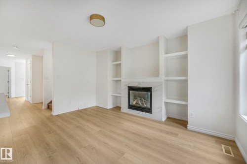 10216 150 Street Nw, Edmonton, AB - Indoor Photo Showing Other Room With Fireplace