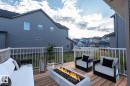 Spacious wood-finish deck with white railings - 2635 Donaghey Crescent, Edmonton, AB 