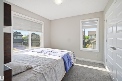 Carpeted room with neutral wall paint and white trim - 1234 Daniels Crescent, Edmonton, AB - Indoor Photo Showing Bedroom