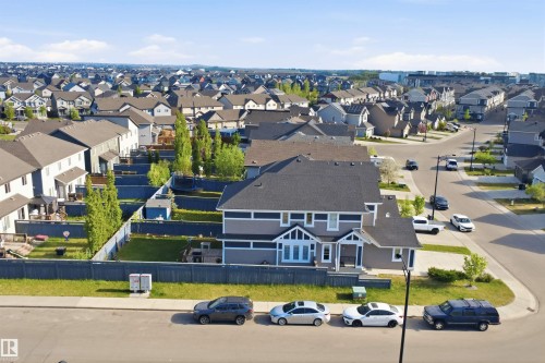 Two-story residence featuring a dark gray roof, light gray siding, and white trim accents - 1234 Daniels Crescent, Edmonton, AB - Outdoor With View
