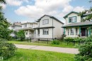 Light-colored siding exterior with dark trim and a covered front porch - 37 Suntree Promenade, Leduc, AB 