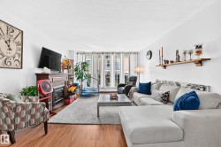 Living area featuring wood-finish Laminate flooring - 