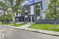 Contemporary triplex with multi-toned facade, featuring dark gray siding, white vertical panels, and wood-finish accents - 