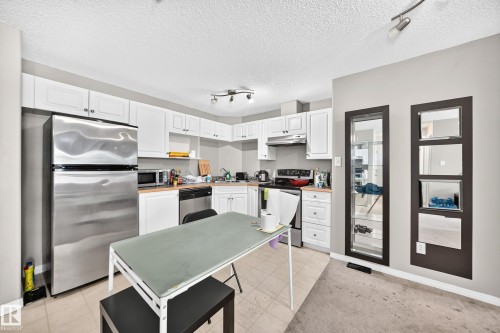 #221 5350 199 St Nw, Edmonton, AB - Indoor Photo Showing Kitchen With Stainless Steel Kitchen