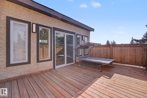 Spacious outdoor deck featuring wood planking and a privacy fence - 60 Mcnabb Crescent, Stony Plain, AB - Outdoor With Deck Patio Veranda With Exterior
