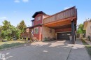 Multi-level residence featuring a red siding exterior and a concrete driveway - 60 Mcnabb Crescent, Stony Plain, AB  - Outdoor 