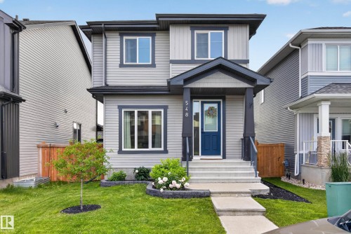 Contemporary two-story residence featuring light gray siding and dark gray trim - 548 Kleins Crescent, Leduc, AB 