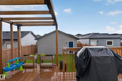 Hardwood deck with a wood pergola structure - 548 Kleins Crescent, Leduc, AB 