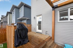 Wood-finish deck with steps and a perimeter fence - 