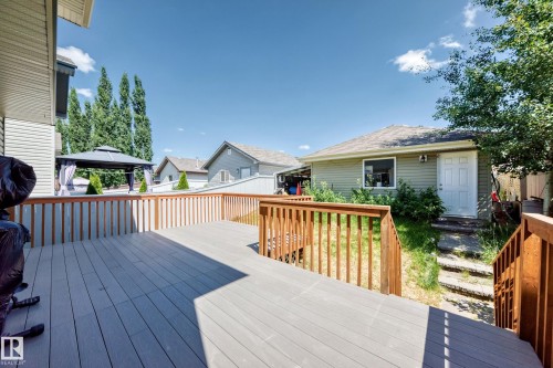 Expansive multi-level composite deck with natural wood railings - 211 59 Street, Edmonton, AB 