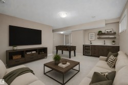 Lower-level entertainment space featuring a built-in wet bar with integrated beverage cooler, dark wood-finish cabinetry, and white countertops - 
