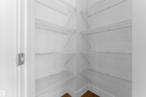 White wire shelving system providing multiple levels of storage - 64 14208 36 Street, Edmonton, AB 