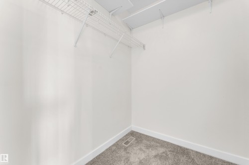 White-painted interior with wire shelving system - 64 14208 36 Street, Edmonton, AB 