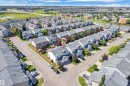 Aerial perspective showcasing a residential community with numerous townhome-style properties - 64 14208 36 Street, Edmonton, AB 
