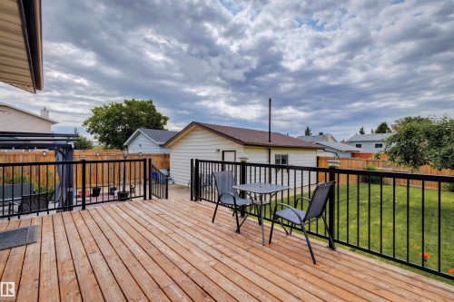 Expansive wood deck with black metal railings - 9315 168 Avenue Nw, Edmonton, AB 