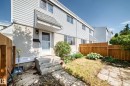 Light gray vinyl siding exterior with concrete steps leading to the front entry - 32 Mcleod Place, Edmonton, AB 