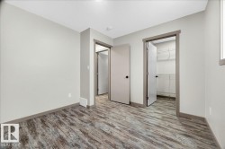 Room featuring wood-finish flooring and light gray walls - 