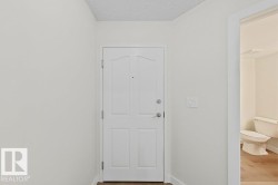 White paneled door with brushed nickel hardware - 