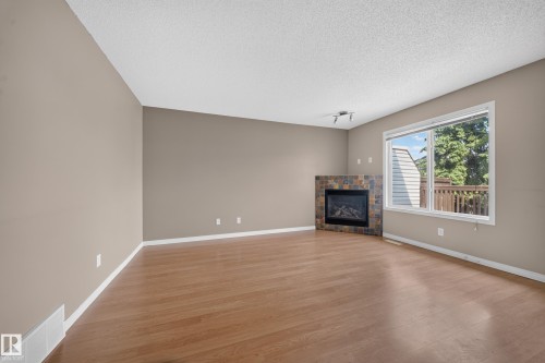 #62 171 Brintnell Blvd Nw, Edmonton, AB - Indoor Photo Showing Living Room With Fireplace