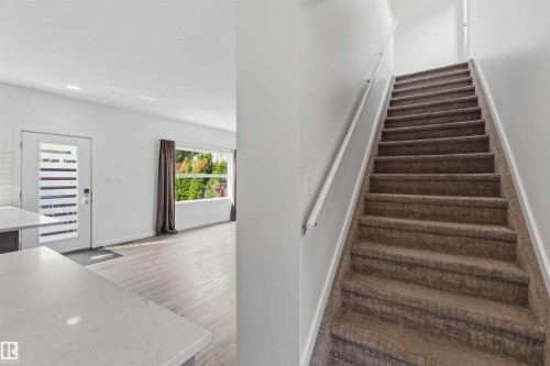 Carpeted staircase with white handrails - 1 14315 Stony Plain, Edmonton, AB 