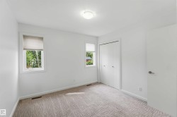 Neutral-toned carpeting complements white wall finishes - 