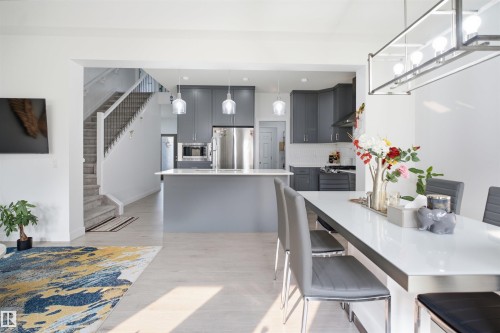 Open-concept living space featuring light wood-finish flooring - 2508 193 Street, Edmonton, AB 