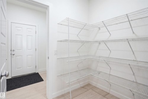 Utility closet featuring multiple levels of wire shelving for storage - 2508 193 Street, Edmonton, AB 