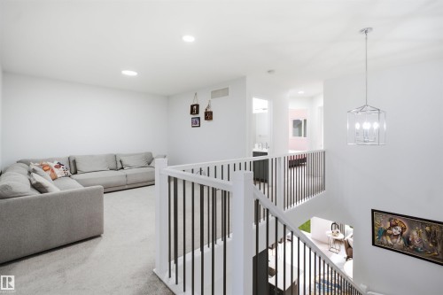 Open concept upper level featuring carpeted flooring and recessed lighting - 2508 193 Street, Edmonton, AB 