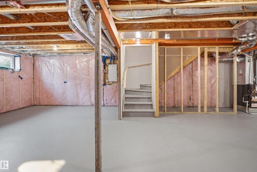 Unfinished basement featuring exposed wood joists, ductwork, and insulated walls - 2508 193 Street, Edmonton, AB 