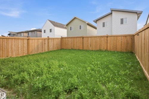 Expansive green space featuring a wood privacy fence - 2508 193 Street, Edmonton, AB 