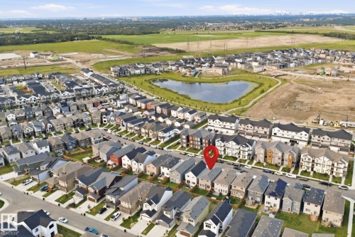 Aerial perspective showcasing a residential development with a prominent detention pond - 2508 193 Street, Edmonton, AB 